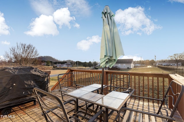 wooden terrace featuring area for grilling