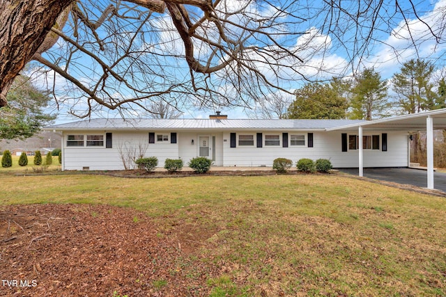 ranch-style house featuring a carport and a front yard