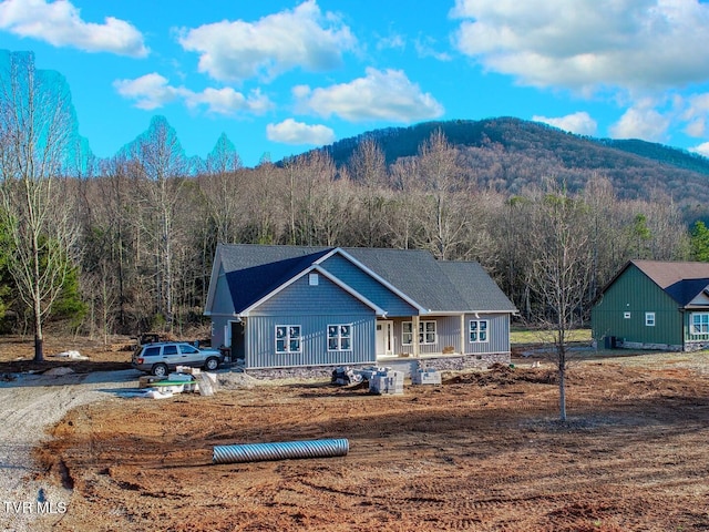 view of front of property with a mountain view