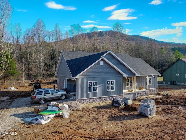 view of front of home featuring a garage and a mountain view