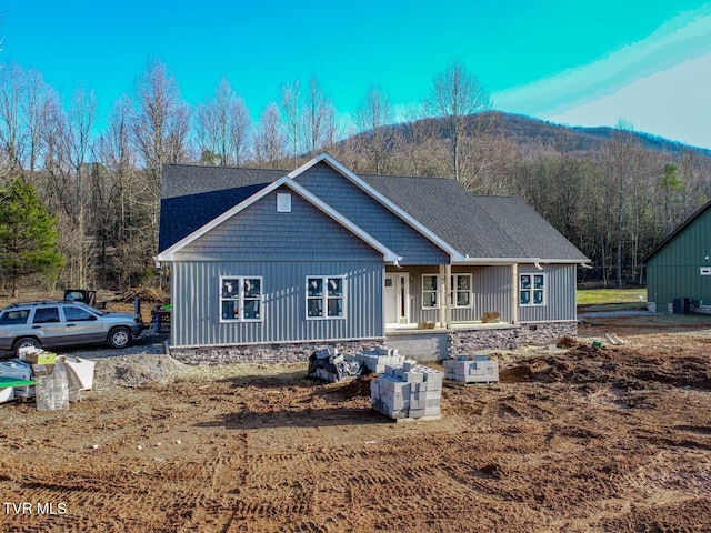 view of front of property with a mountain view