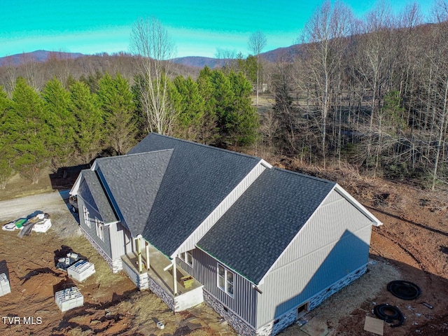 birds eye view of property featuring a mountain view