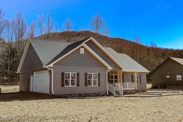 view of front of property with a garage and covered porch