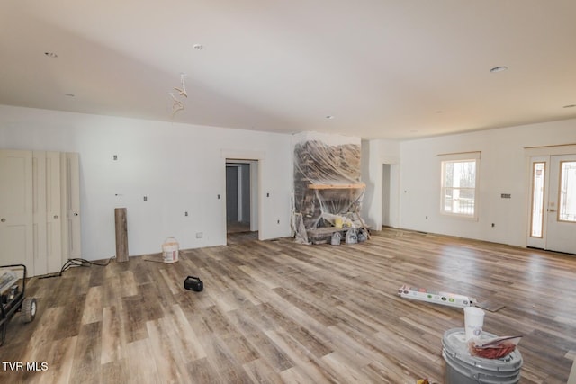 unfurnished living room with wood finished floors