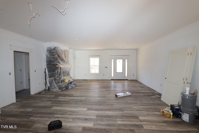 unfurnished living room featuring wood finished floors