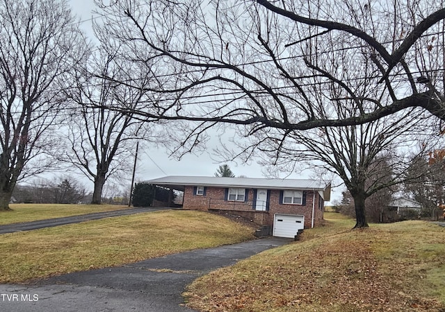 view of front of home with a garage and a front yard