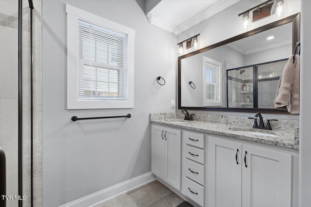 bathroom featuring vanity, crown molding, a shower with shower door, and plenty of natural light