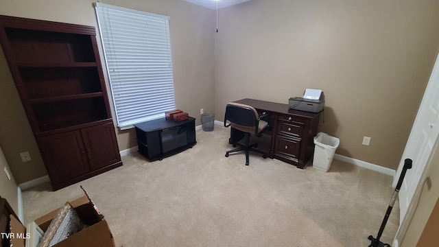 office area featuring light colored carpet