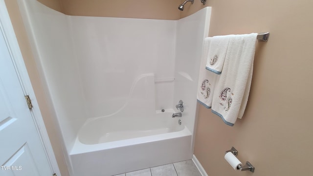 bathroom with tile patterned flooring and shower / washtub combination