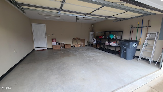 garage featuring water heater and a garage door opener