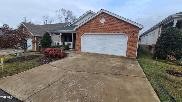 view of front of property featuring a garage and covered porch