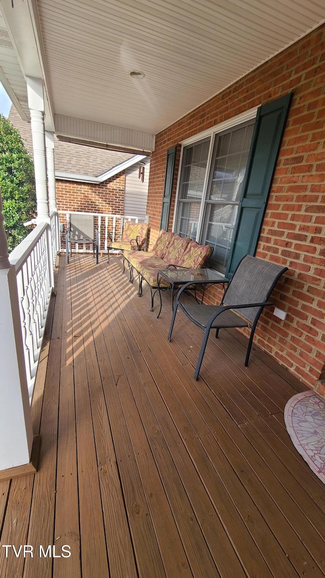 deck featuring covered porch