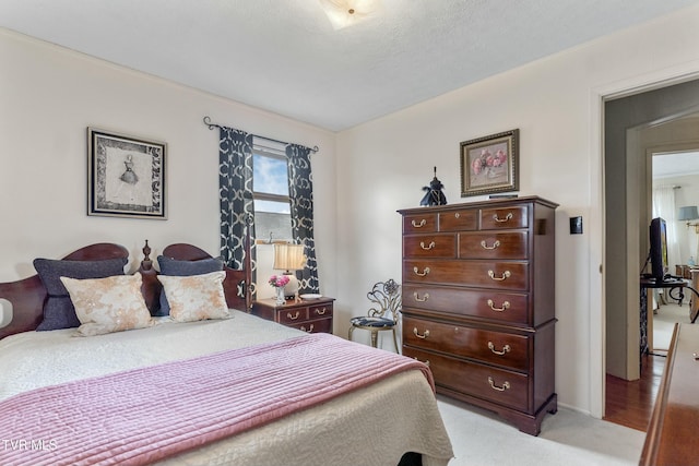 bedroom featuring light carpet