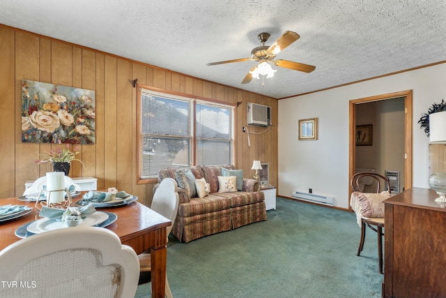 carpeted living room with a baseboard heating unit, ceiling fan, crown molding, a textured ceiling, and a wall mounted AC