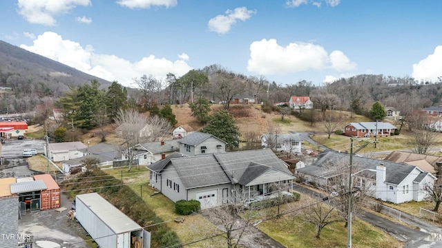 birds eye view of property featuring a mountain view and a residential view