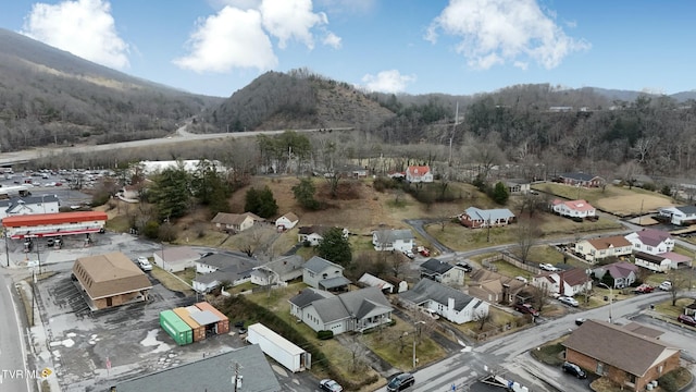 birds eye view of property with a mountain view and a residential view