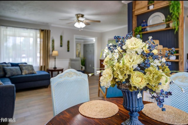 dining area featuring hardwood / wood-style flooring and ceiling fan