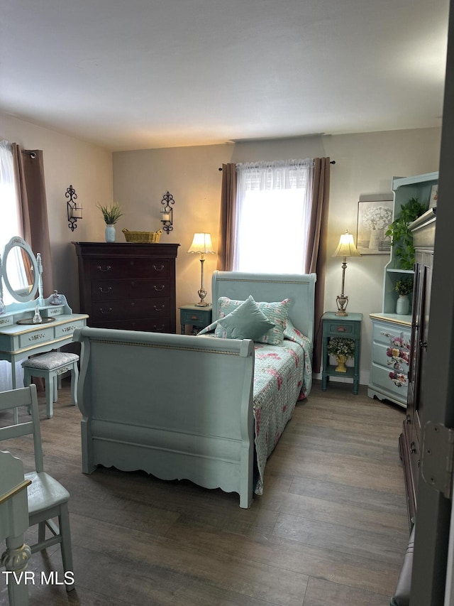 bedroom with hardwood / wood-style floors