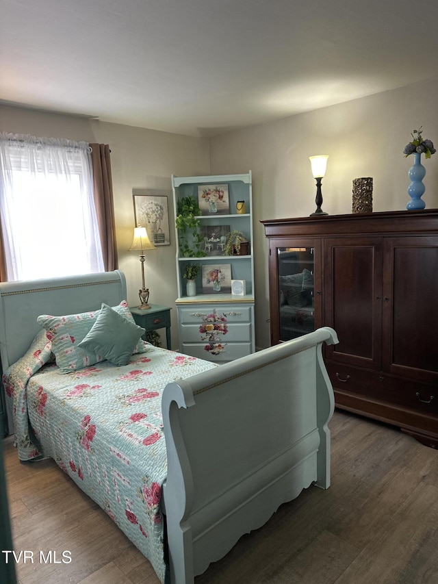 bedroom featuring hardwood / wood-style flooring