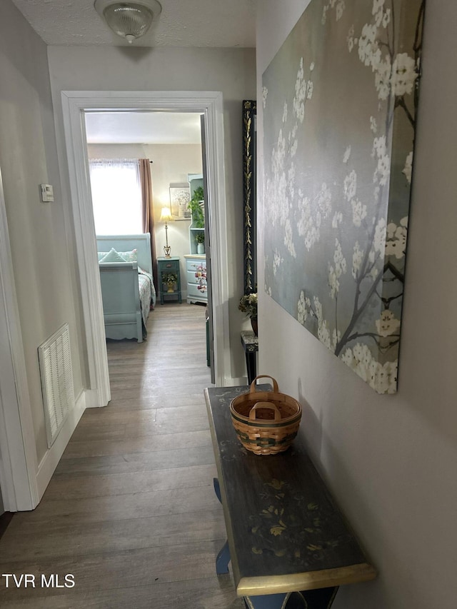 corridor featuring hardwood / wood-style flooring