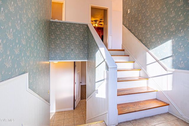 staircase with tile patterned floors and ceiling fan