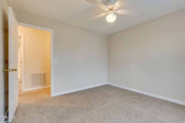 carpeted empty room with ceiling fan