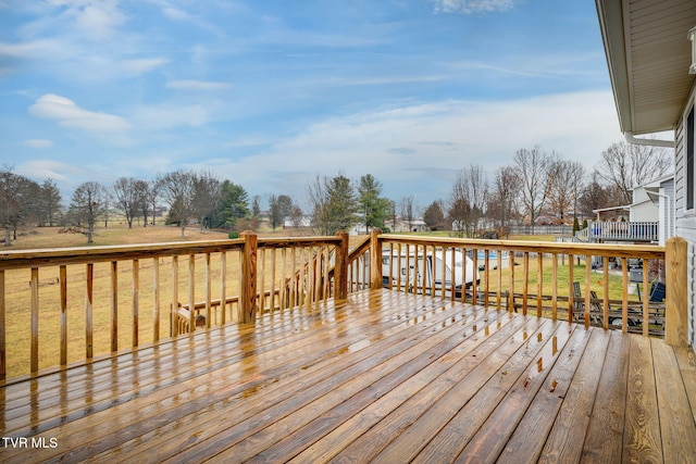 wooden deck with a yard