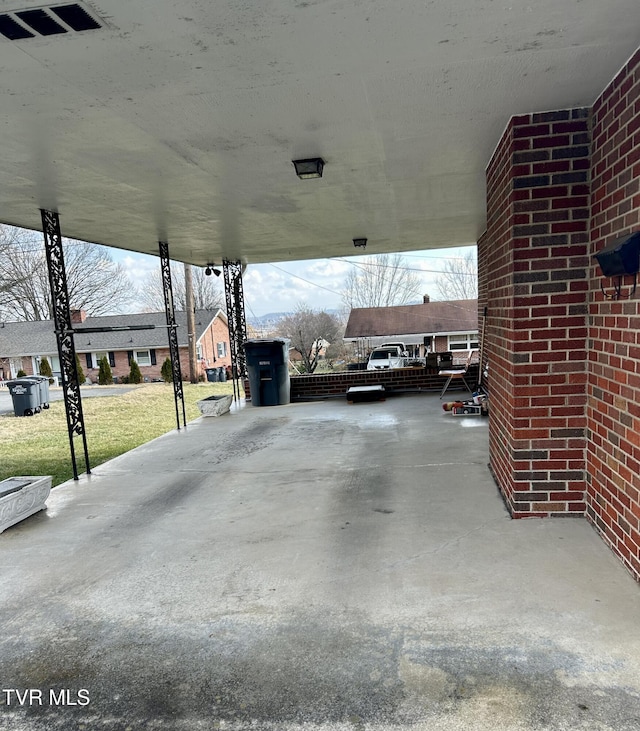 view of patio / terrace featuring a carport