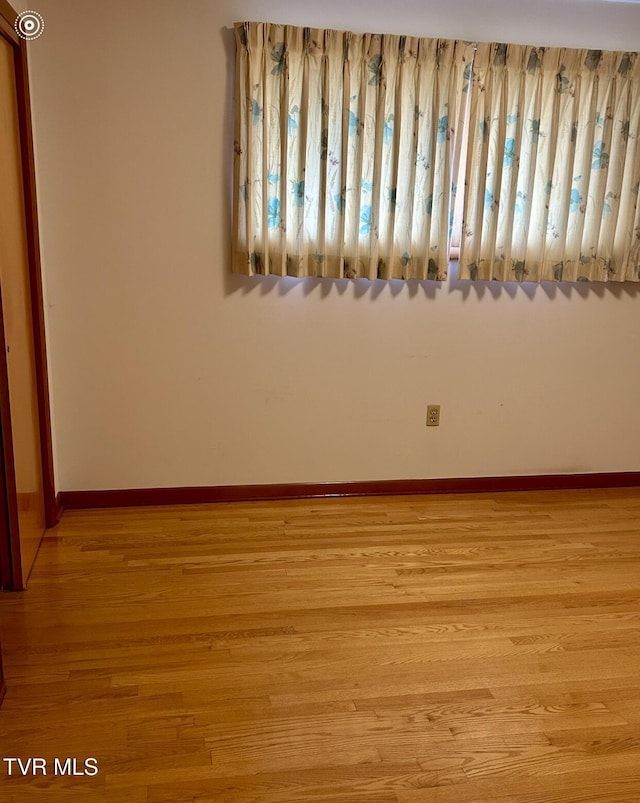 spare room featuring light hardwood / wood-style flooring