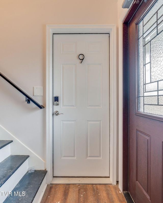 entryway with hardwood / wood-style floors