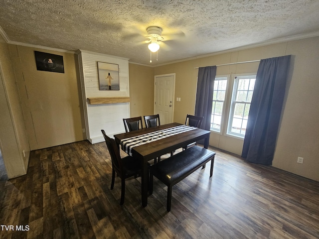 dining area featuring ornamental molding, dark hardwood / wood-style floors, and a textured ceiling