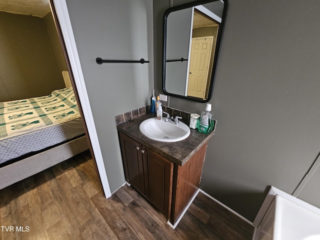 bathroom featuring vanity and hardwood / wood-style flooring