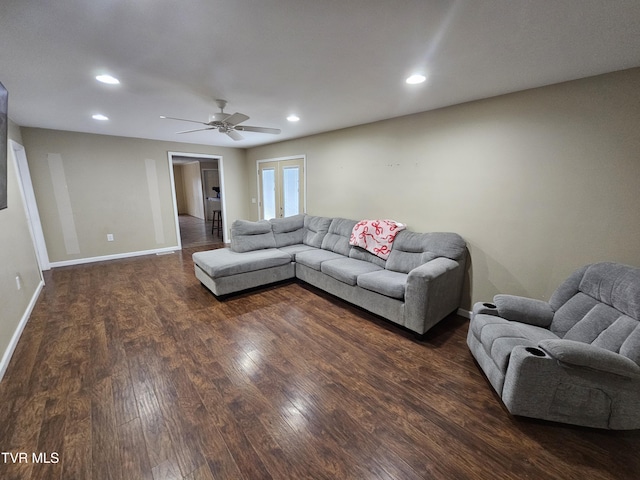 living room with dark wood-type flooring, ceiling fan, and french doors