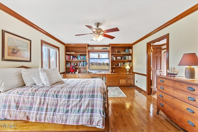 bedroom with crown molding, ceiling fan, and light hardwood / wood-style floors