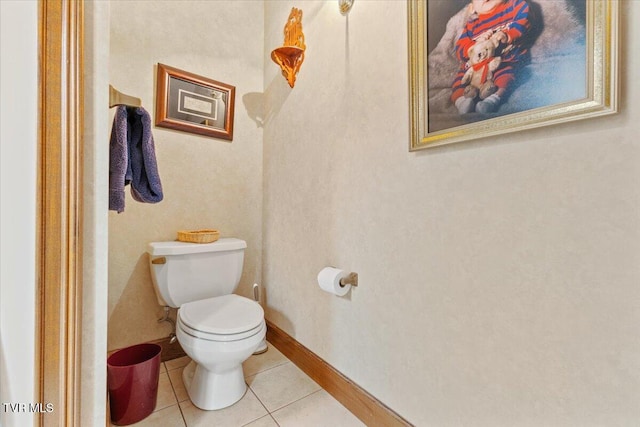 bathroom with tile patterned flooring and toilet