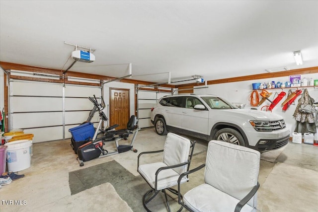 garage featuring a garage door opener