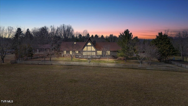 view of front of home featuring a lawn