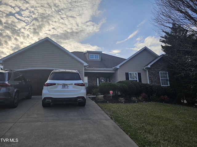 view of front of property with a garage and a front yard