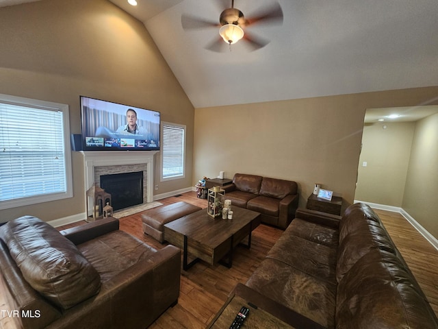 living room featuring ceiling fan, high vaulted ceiling, and hardwood / wood-style floors