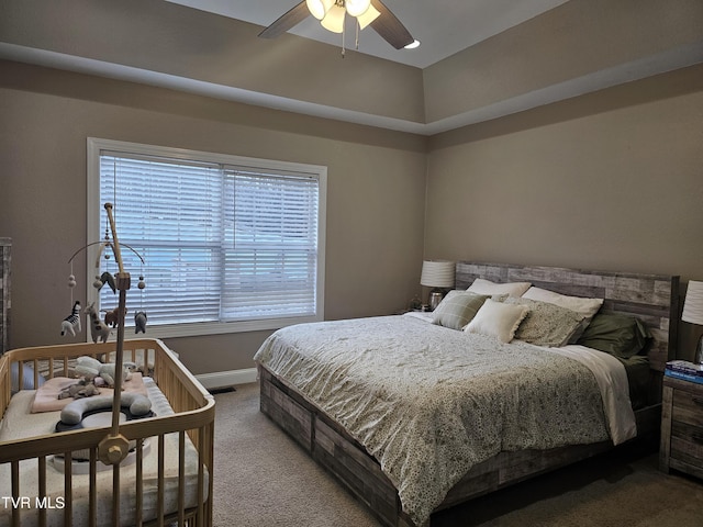 carpeted bedroom with ceiling fan