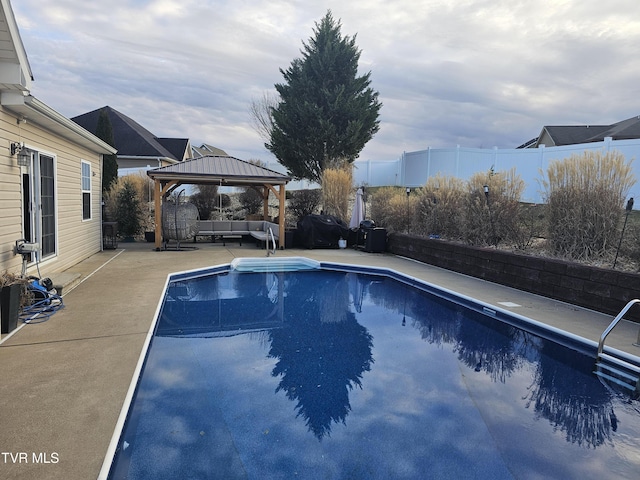 view of pool featuring a gazebo and a patio