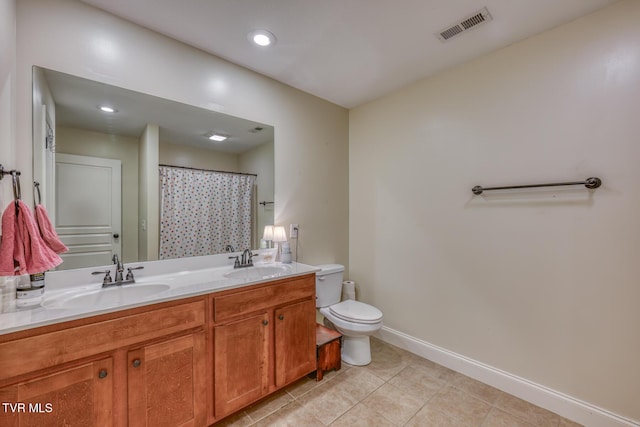 bathroom with vanity, tile patterned flooring, a shower with curtain, and toilet