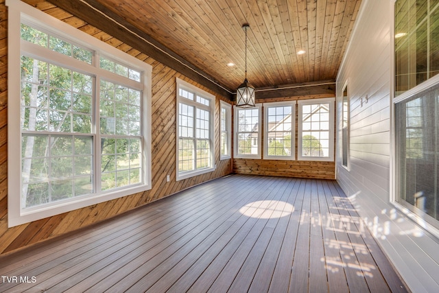 unfurnished sunroom featuring wooden ceiling and a notable chandelier