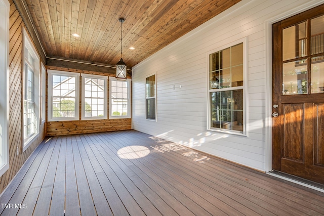 unfurnished sunroom with wooden ceiling