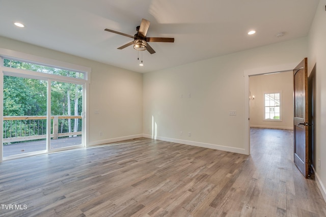 empty room with baseboards, ceiling fan, recessed lighting, and light wood-style floors