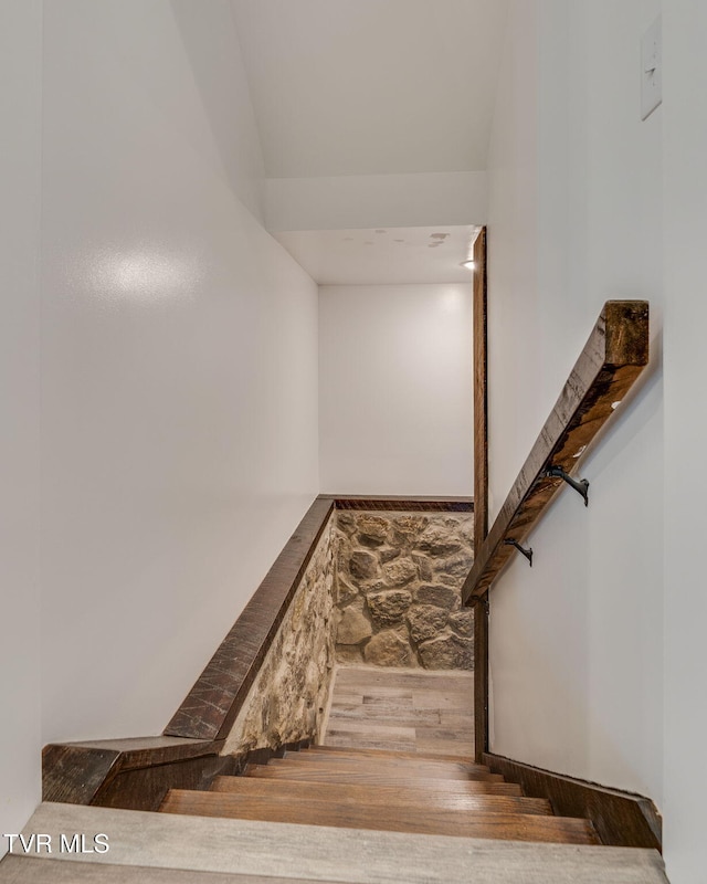 stairs with wood finished floors