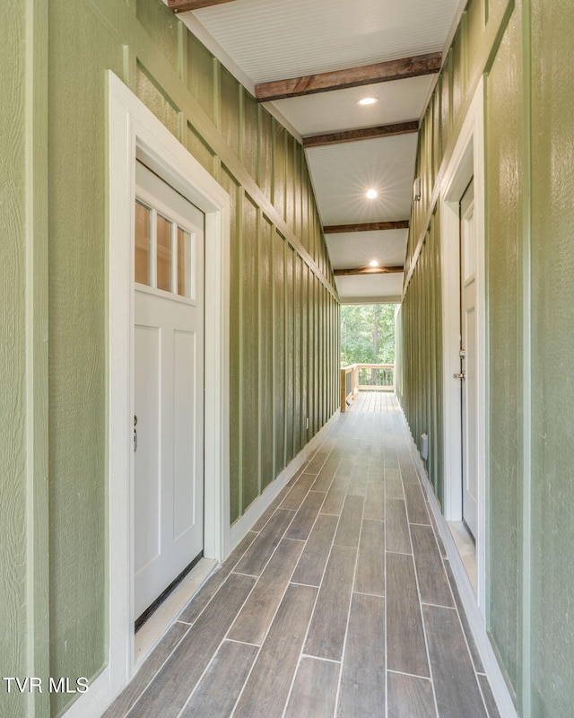 corridor with wood finish floors and recessed lighting