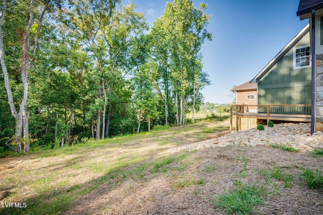 view of yard with a wooden deck