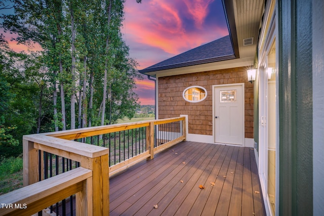 wooden deck featuring visible vents