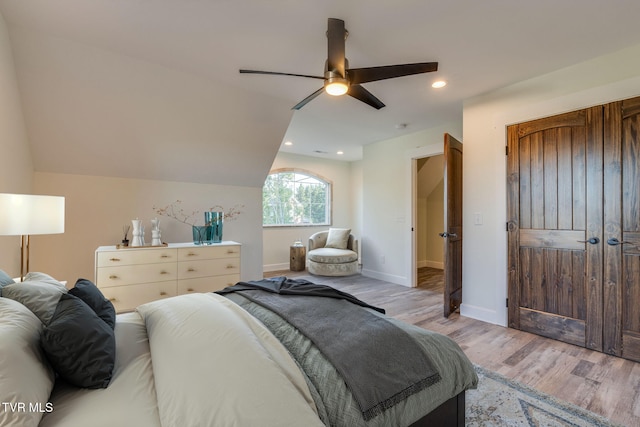 bedroom with baseboards, a ceiling fan, vaulted ceiling, light wood-style floors, and recessed lighting